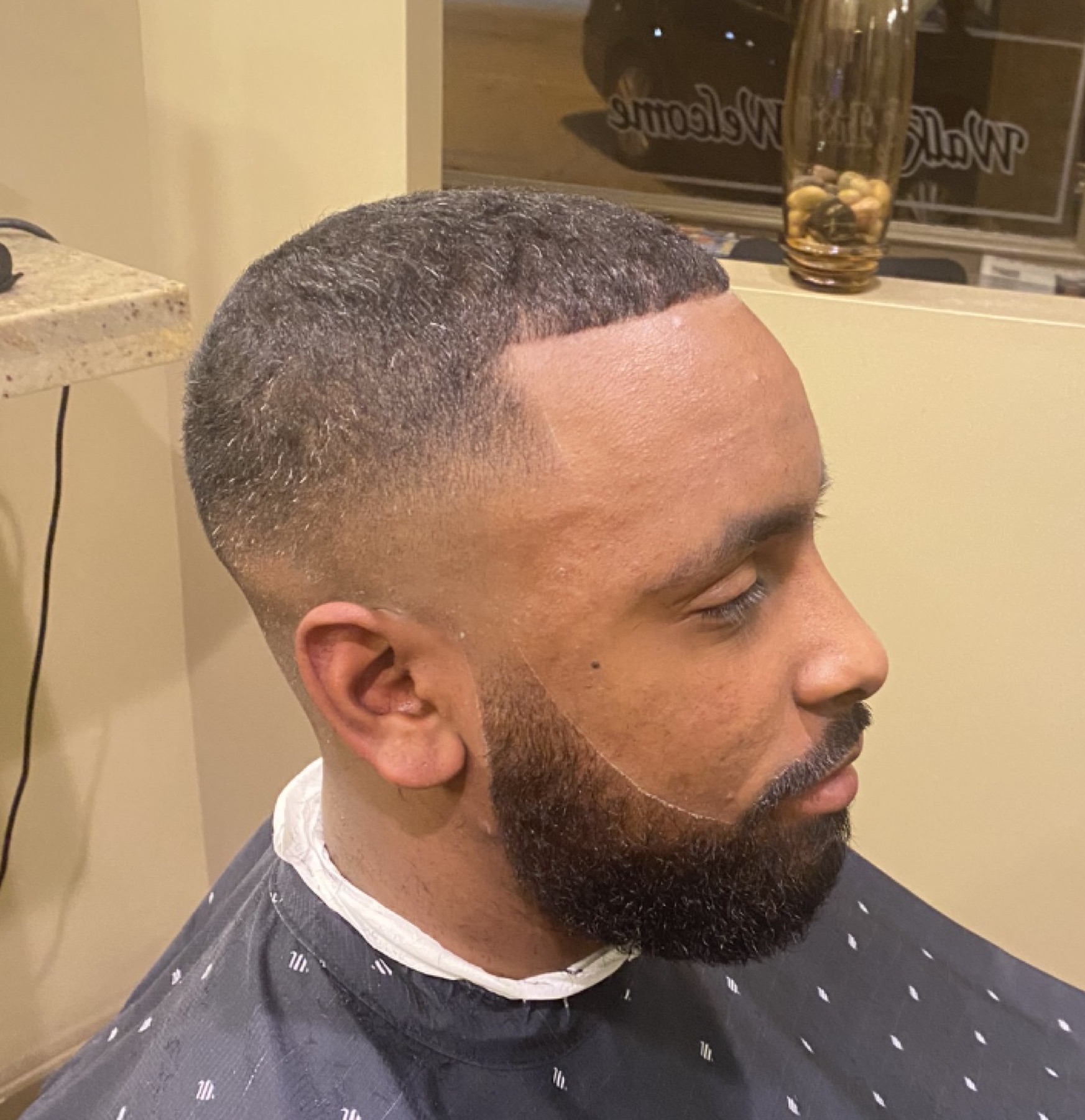 Noble Wolf cut with a crisp lineup and tailored beard
